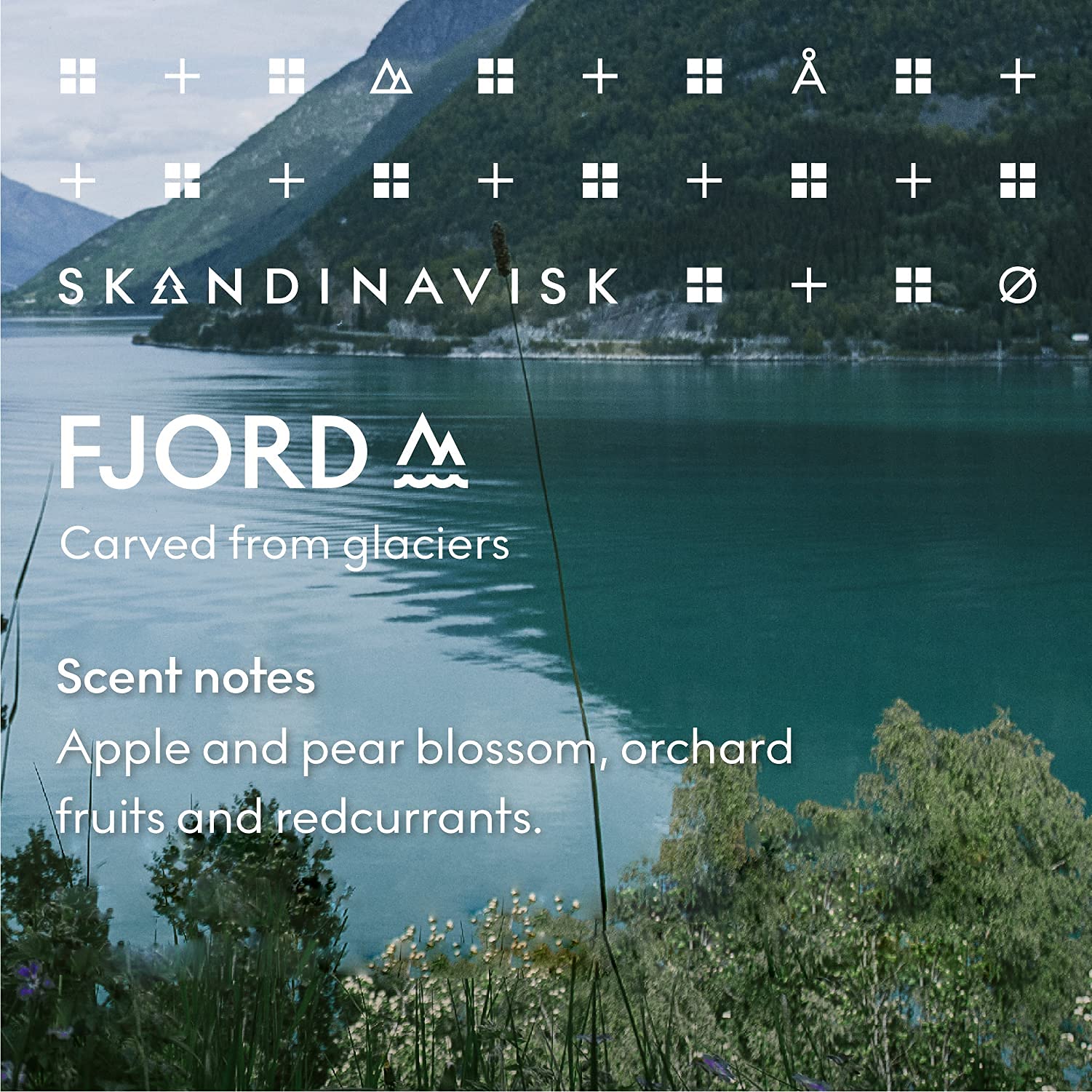 Skandinavisk Fjord Scented Candle. Fragrance Notes: Apple and Pear Blossom, Orchard Fruits and Redcurrants. 7.0 oz.